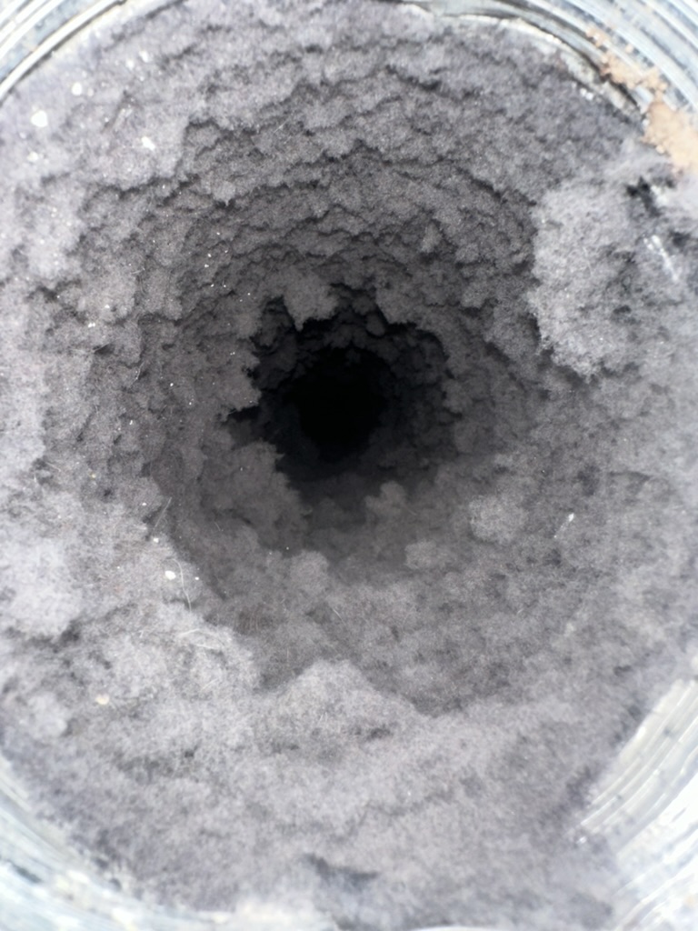 Clogged dryer vent full of lint buildup - fire hazard
